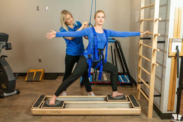 woman using solo-step with stretches in therapy for benefits for patients