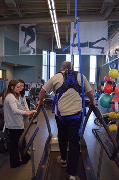 man using treadmill in physical therapy