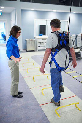 Man practicing gait training exercises