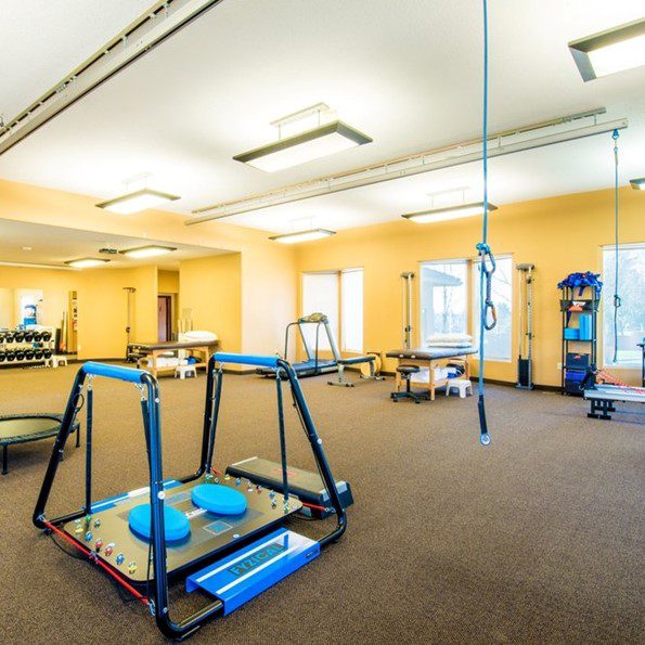 A yellow Physical Therapy room with straight tracks from the solo step track system