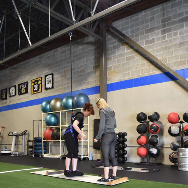 Patient using solo step during physical therapy