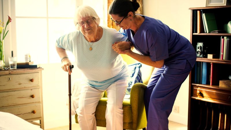 elderly patient with physical therapist