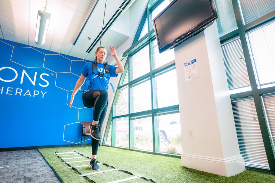 patient working in physical therapy with solo step